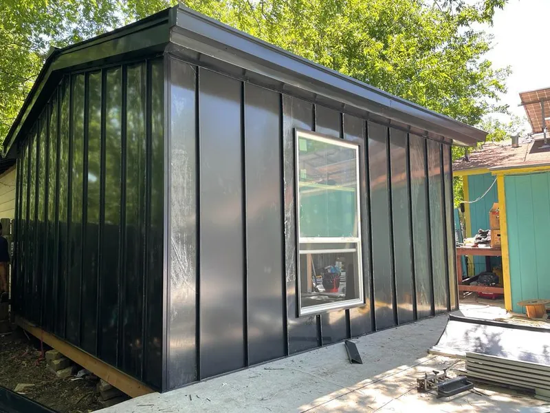 Black standing seam metal wall panels for Roof Inspection in Pascagoula